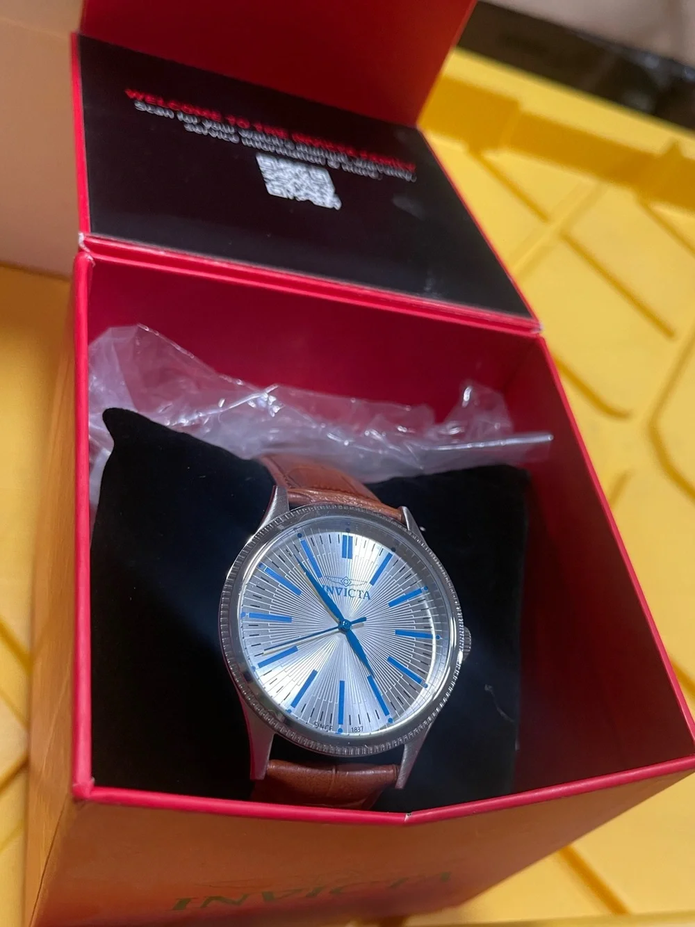 Invicta Silver Dial Watch with Blue Accents and Brown Leather Strap